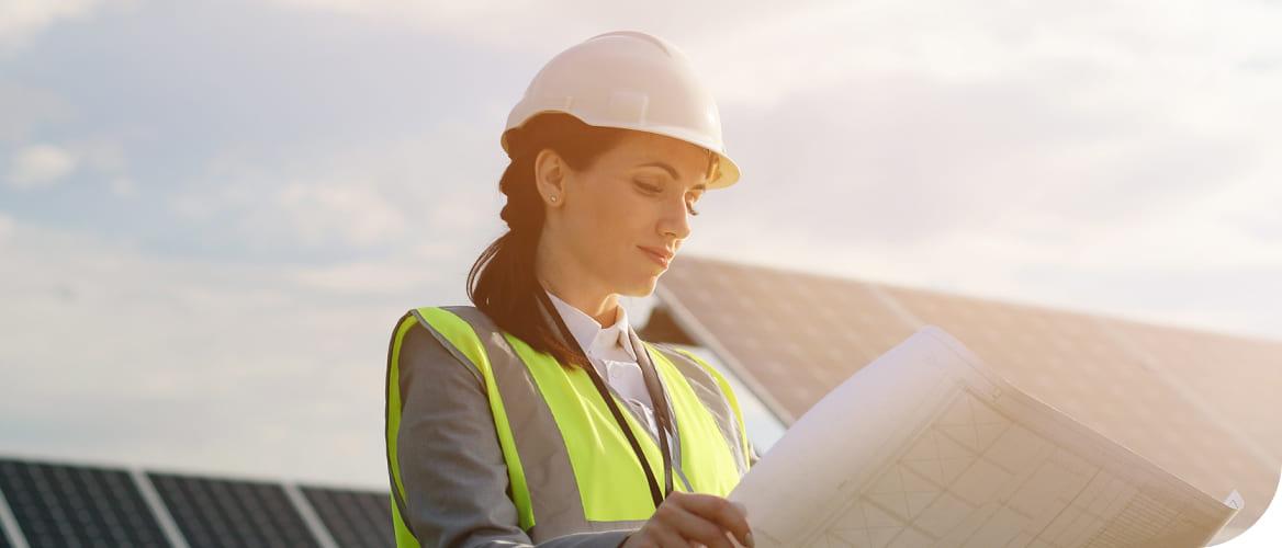 female engineer looking at a building plan